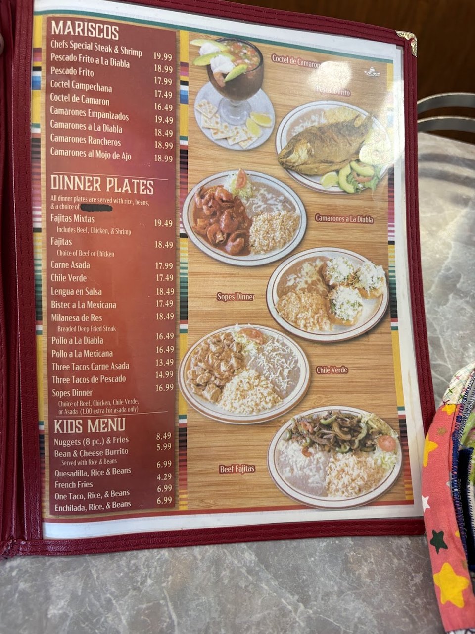 Printed menu with burritos, quesadillas, and tortas.